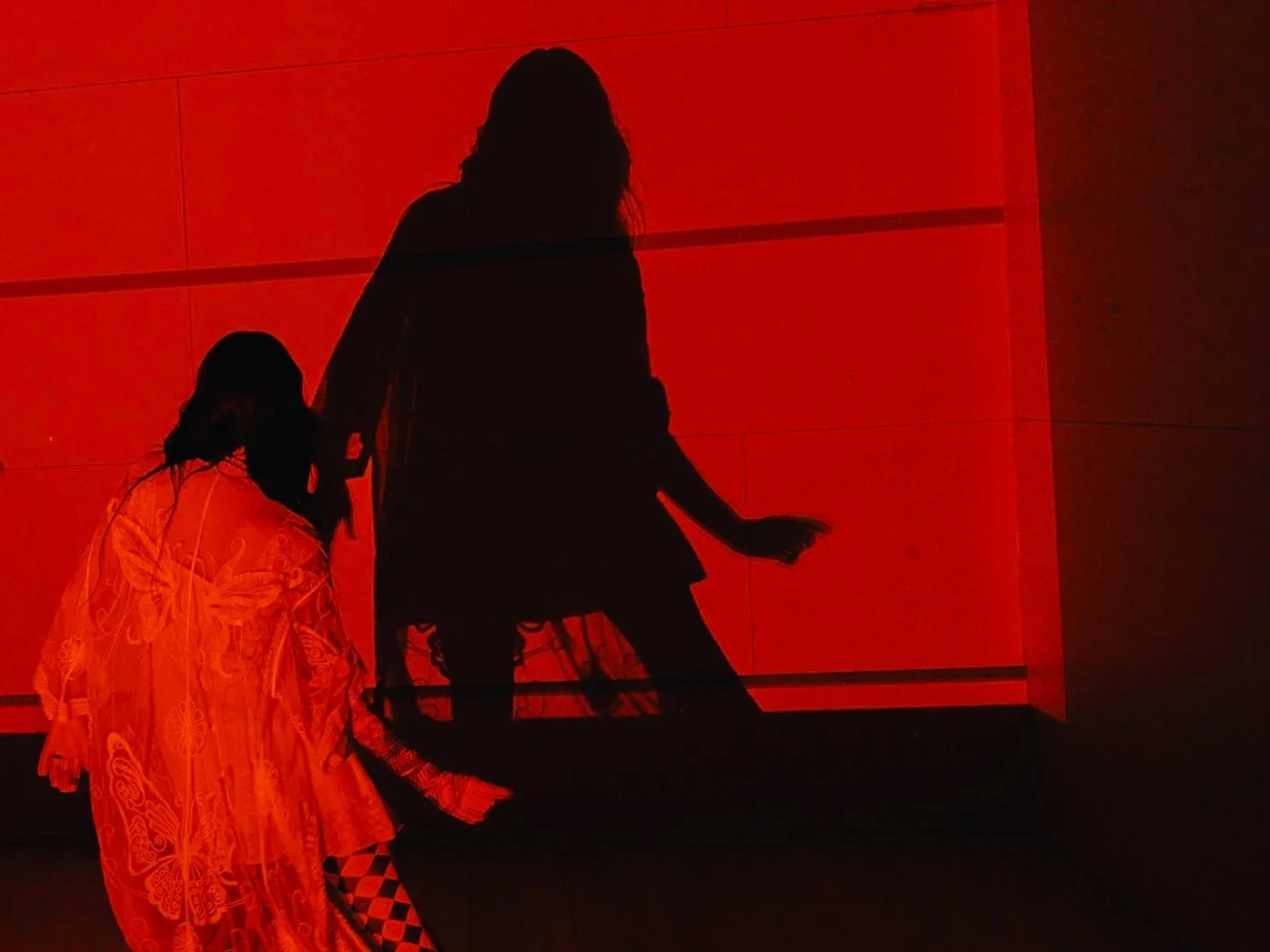 Red-lit live performance and visual installation